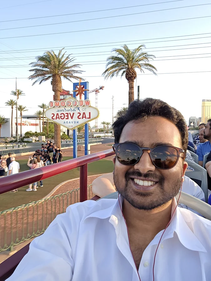 Amogh taking a selfie by the mirrored Welcome to Fabulous Las Vegas sign