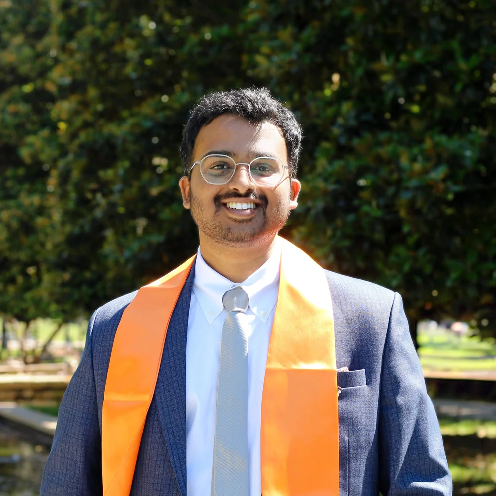 Amogh smiling in his UT Dallas graduation attire
